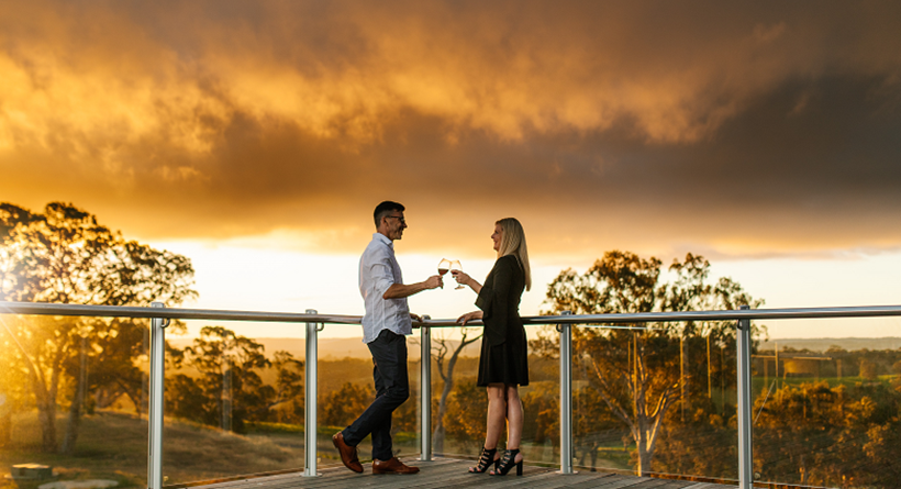 Petaluma deck and two people enjoying wine